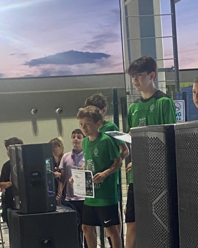 Sandro Abesadze receiving a football award certificate