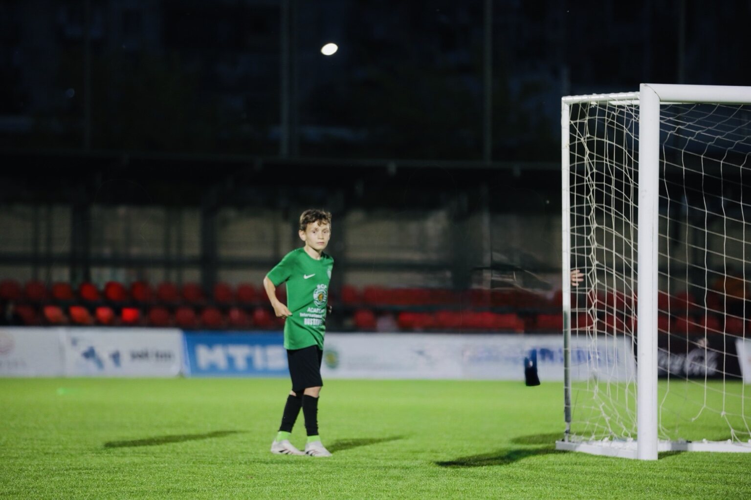 Sandro Abesadze positioned near the goal during a night training session