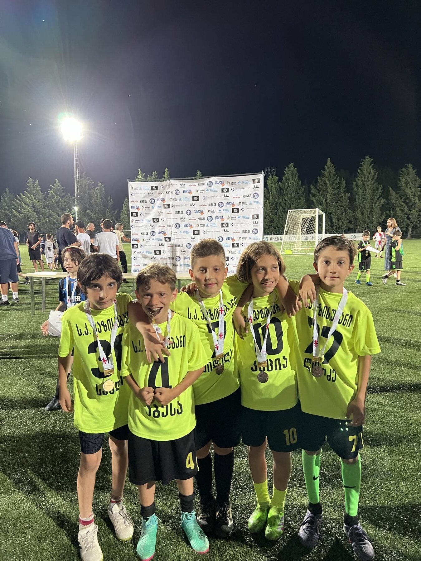 Sandro Abesadze and teammates wearing medals after a night tournament
