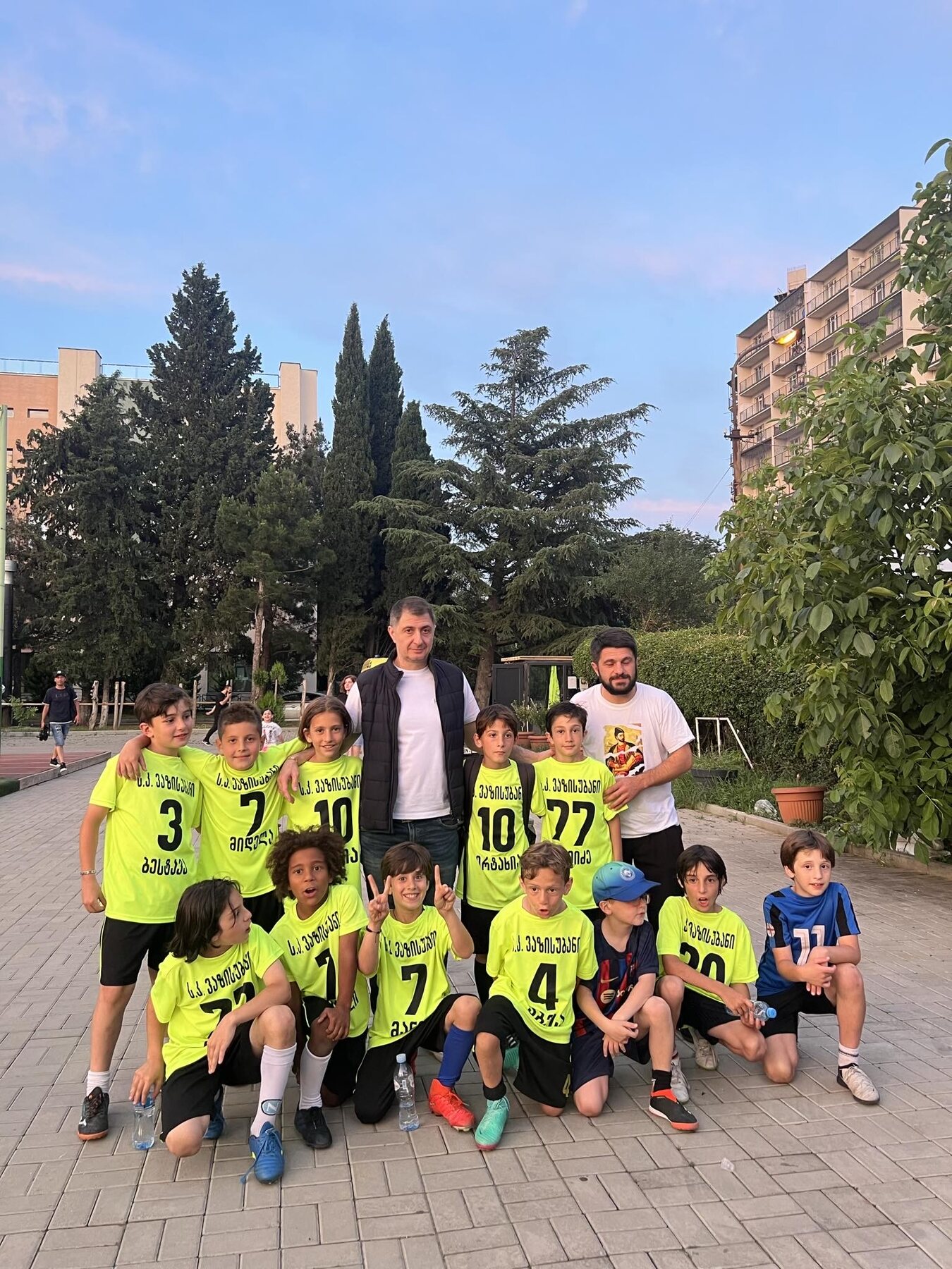 Sandro Abesadze posing with his full team and coaches after a tournament