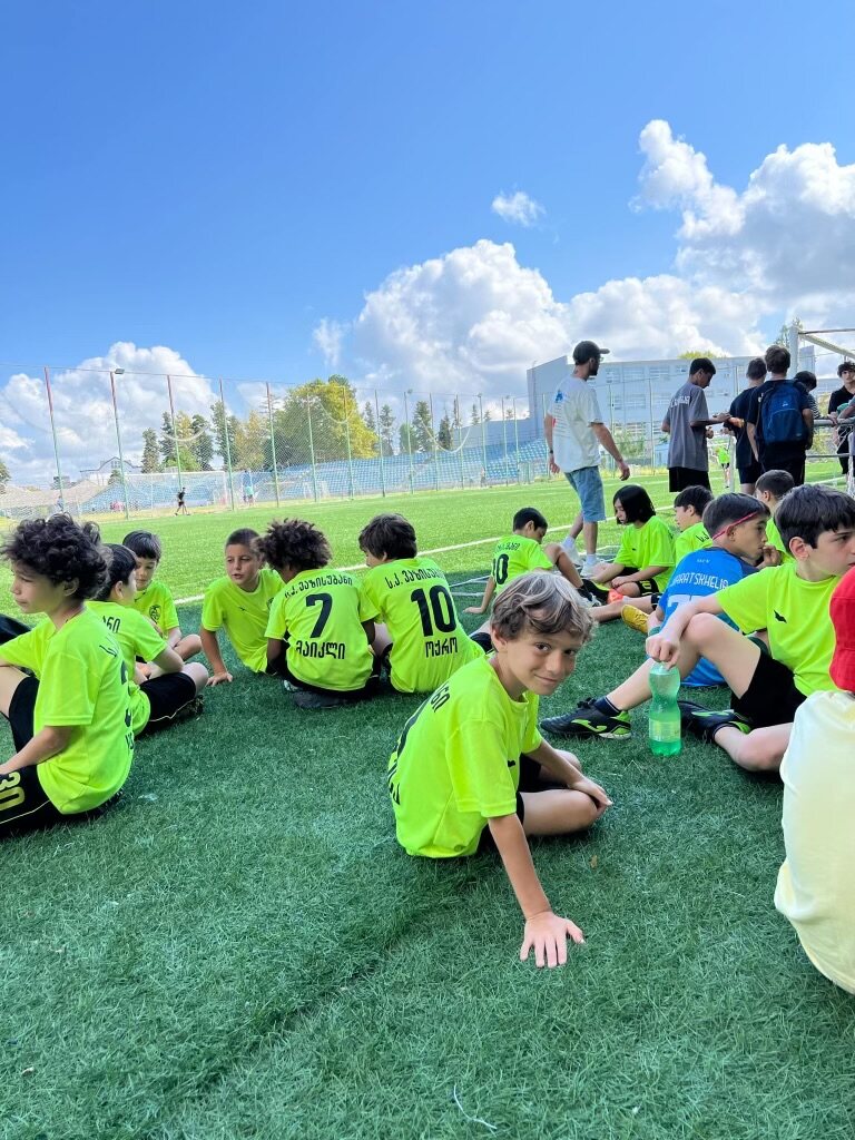Sandro Abesadze taking a break with other young football players